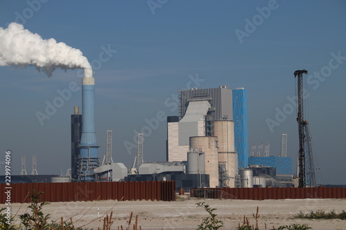 Steam comes out the chimney of the coal power plant of Engie in the Rotterdam Maasvlakte harbor in The Netherlands.