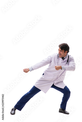 Young handsome doctor under pressure isolated on white © Elnur