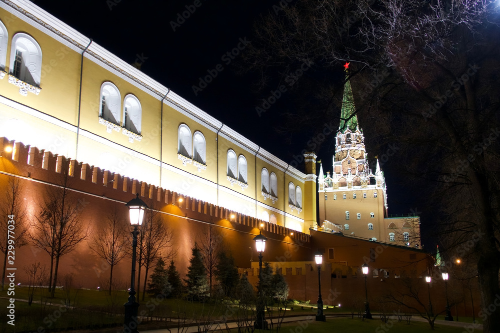 Architectural details of building near Red Square in Moscow illuminated at night.
