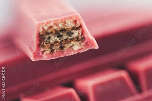 Finger Ruby Chocolate Bar made from ruby cocoa bean. New dimension of chocolate sweets. photo