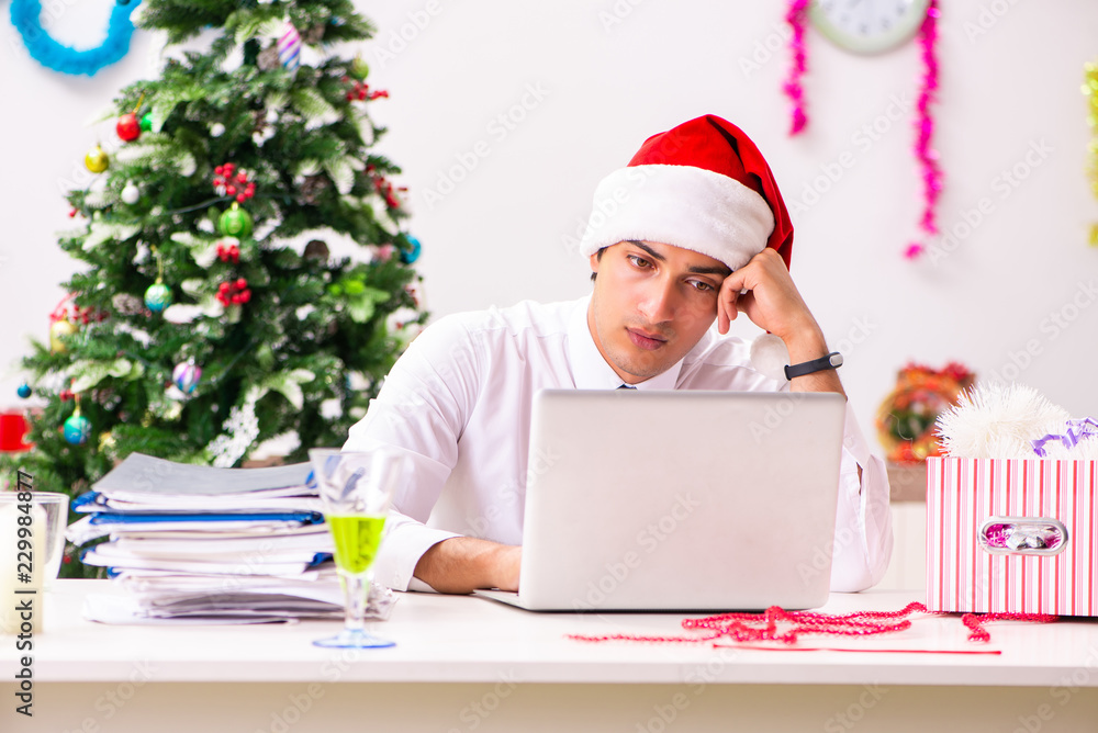 Employee businessman celebrating christmas in office Employee businessman celebrating christmas in office