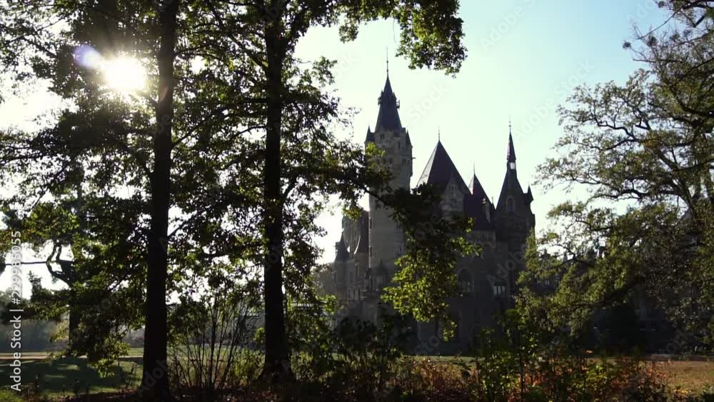 Sculpture in park at Moszna Castle on sunny day, Poland