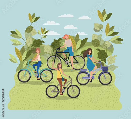 group of young women in bicycle on park