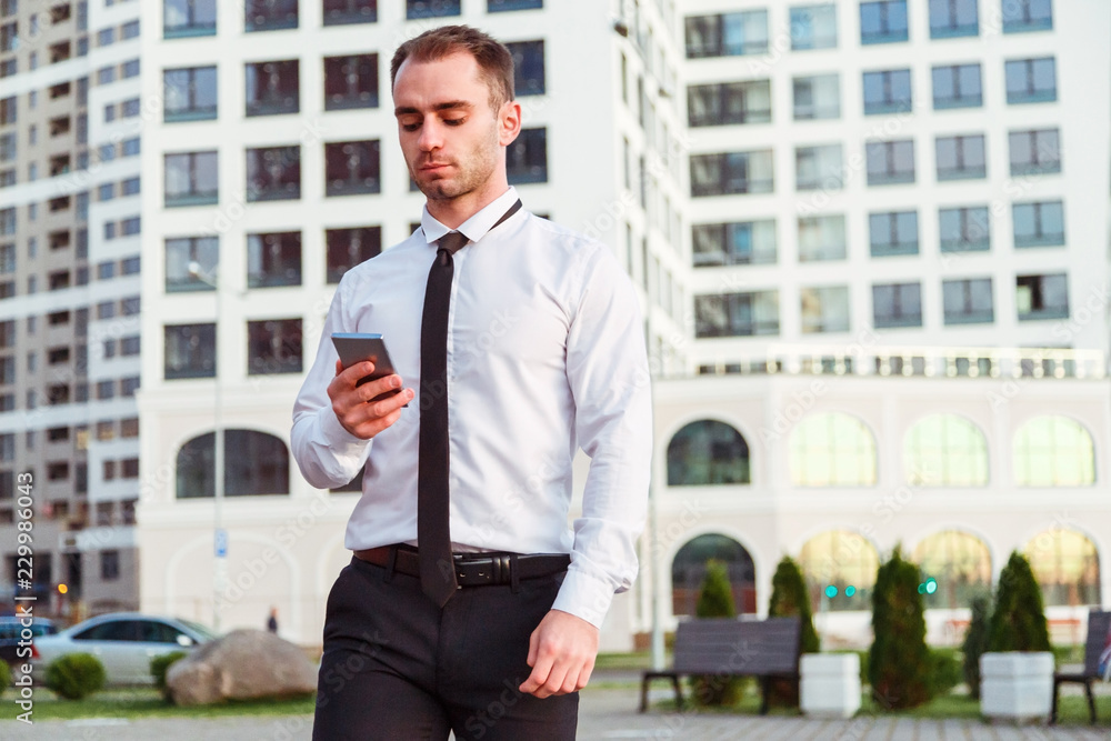 Businessman holding mobile smartphone using app Businessman holding mobile smartphone using app