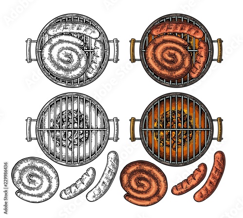 Barbecue grill top view with charcoal and sausage