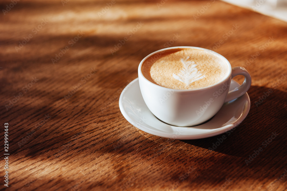Obraz premium coffee cup latte art in cafe