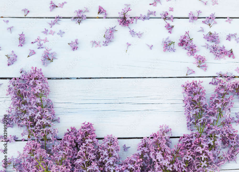 Bouquet of lilacs flowers on a light blue shabby wooden background. Vintage floral background with purple flowers. Copy space Bouquet of lilacs flowers on a light blue shabby wooden background. Vintage floral background with purple flowers. Copy space