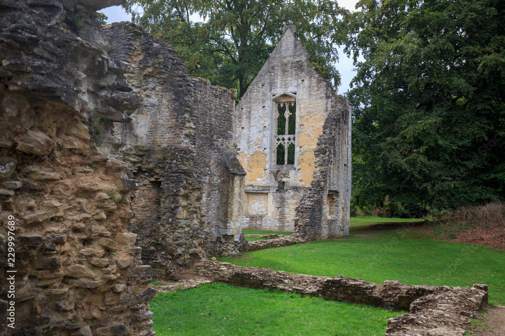 Ruins of old church walls and foundation in the English countryside