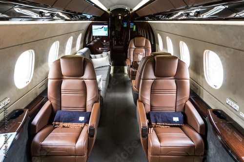 Luxury interior in bright and brown colors in the private business jet