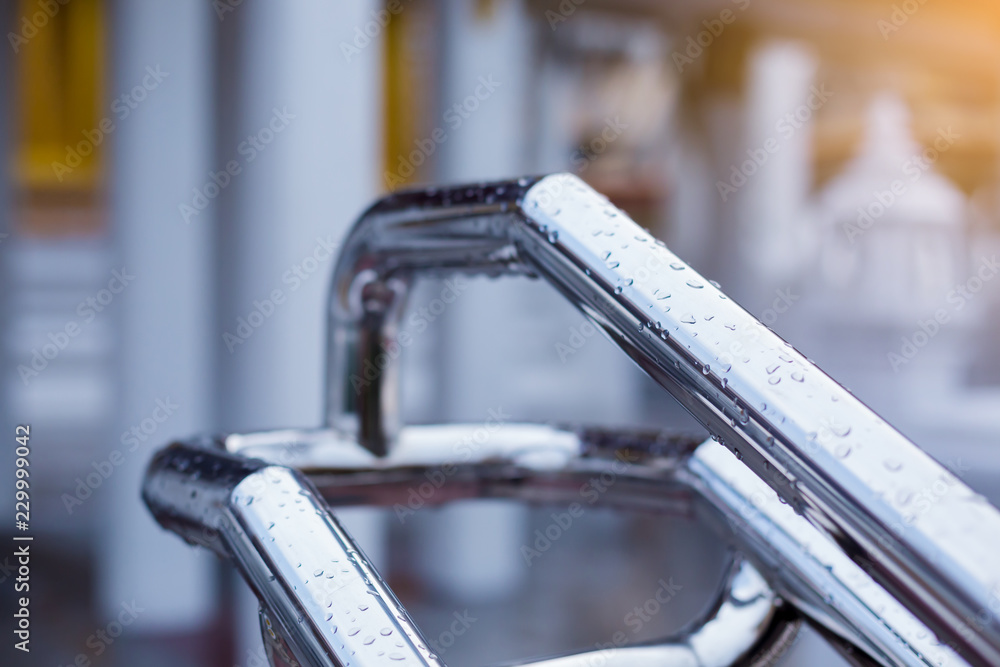 Obraz premium The Wet Railings Of Stainless Steel under The Rain Drops