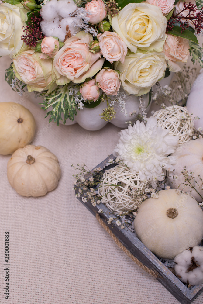 bouquet of white pumpkins with chrysanthemum and gypsophila in a wooden box on a light background bouquet of white pumpkins with chrysanthemum and gypsophila in a wooden box on a light background