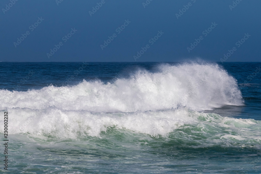 Waves booming against the seashore