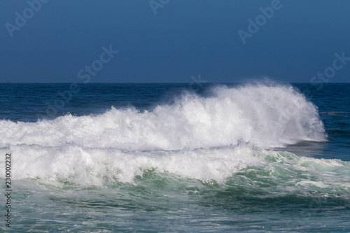 Waves booming against the seashore