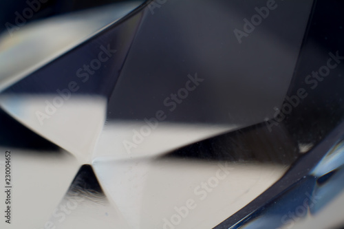 Diamond elements close-up on a black background. Abstraction. Defocused.