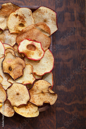 Slices of dried apples on wooden table
