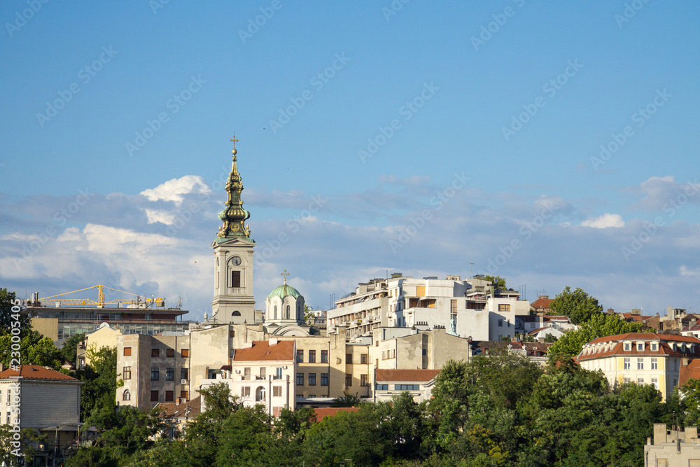 Panorama of the old city of Belgrade with a focus on Saint Michael Cathedral, also known as Saborna Crkva, with its iconic clocktower seen from afar. belgrade is the capital city of Serbia