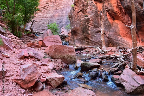 Kanarraville Falls, views from along the hiking trail of falls, stream, river, sandstone cliff formations Waterfall in Kanarra Creek Canyon by Zion National Park, Utah, USA. photo