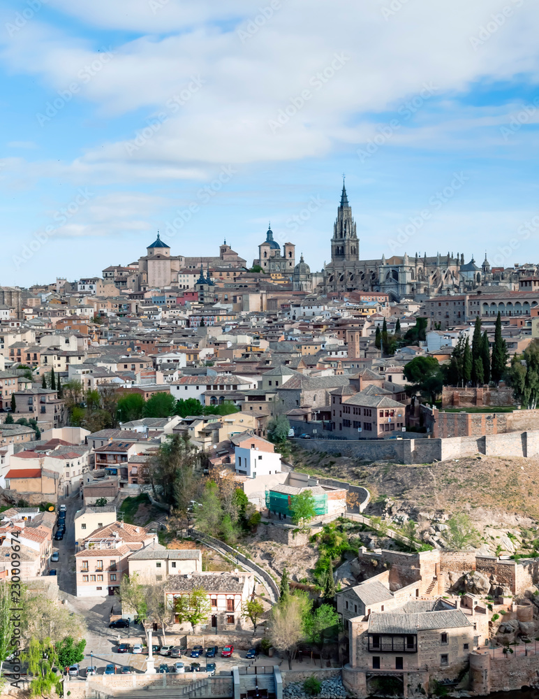 View of the Spanish city of Toledo, seen from the Gothic cathedral of Santa Maria and the Tagus river, in a structure of medieval city