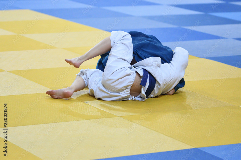 Naklejka premium Girls compete in Judo