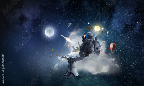 Space fantasy image with astronaut. Mixed media