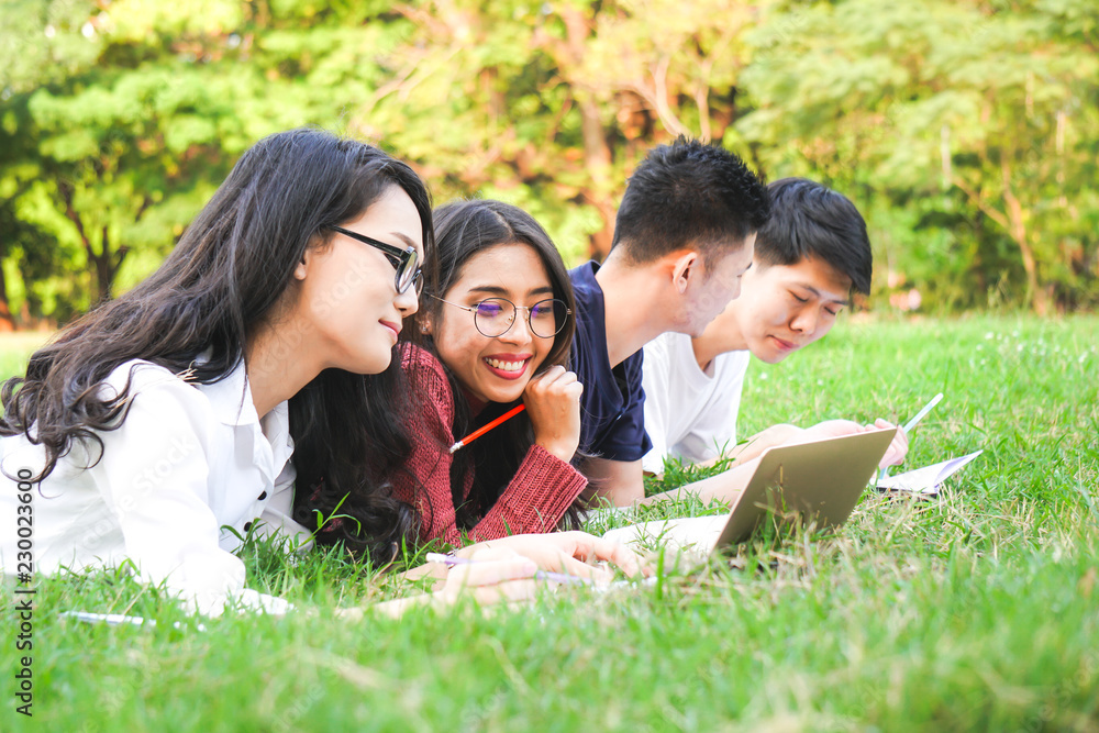 Asian teenage learning together in park for education concept Asian teenage learning together in park for education concept