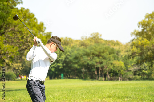 Golf player is driving in golf court