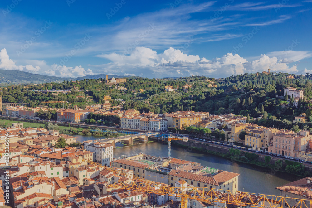 Houses and hills by Arno River in Florence, Italy