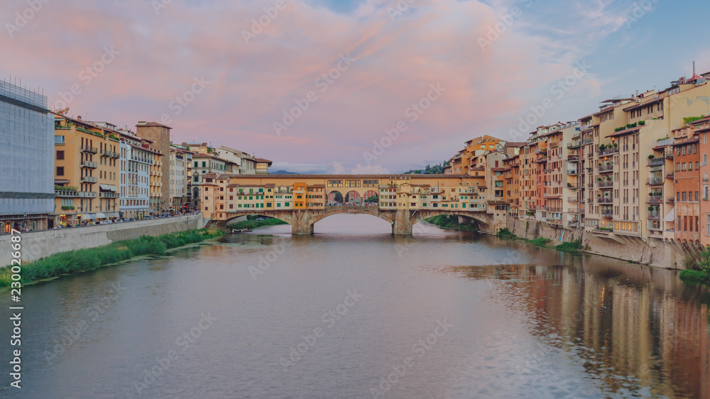 Ponte Vecchio over Arno River at dusk in Florence, Italy