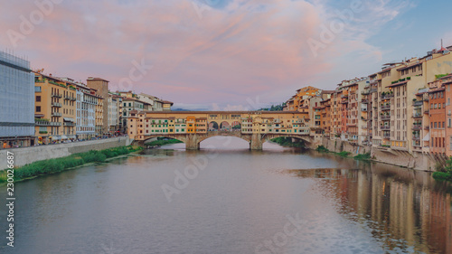 Ponte Vecchio over Arno River at dusk in Florence, Italy