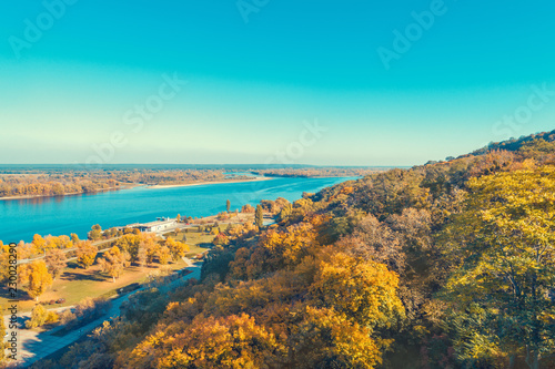 Aerial view at the Dnieper river and embankment near Taras Hill (Chernecha Hora) in autumn. Kaniv, Ukraine, Europe