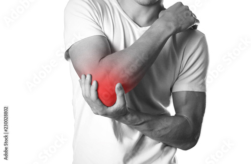 A man holding hands. Pain in the elbow. The hearth is highlighted in red. Close up. Isolated on white background