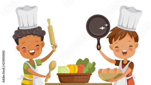 Boys cooking Small boys cooking together with friends in Cooking Classes. Or in the kitchen at home. Happy laugh. Learn and improve cooking skills.  Isolated 