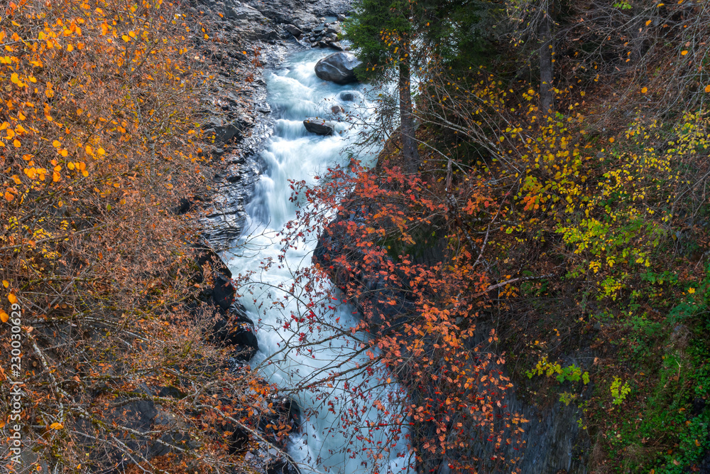 Wild river stream among cliffs and rocks, Enguri, autumn time in Mestia, Svaneti, Georgia Wild river stream among cliffs and rocks, Enguri, autumn time in Mestia, Svaneti, Georgia