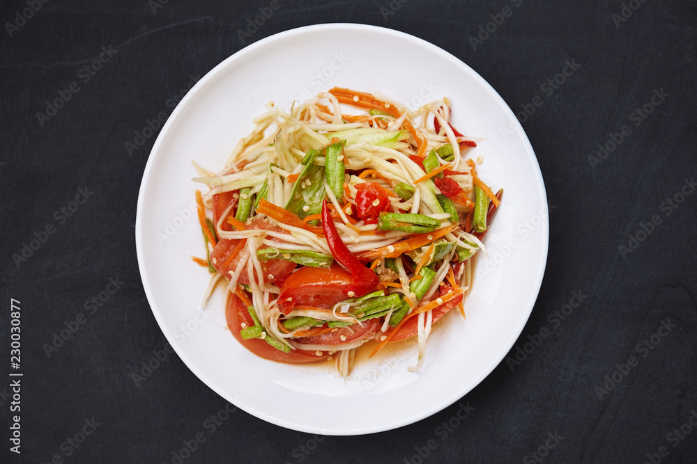 Top view of Som tam or papaya salad. Top view of Som tam or papaya salad.