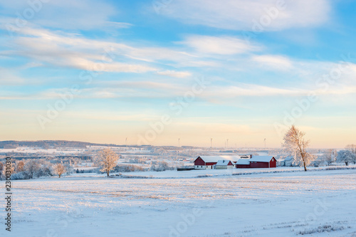 Winter landscape in the countryside with a farm