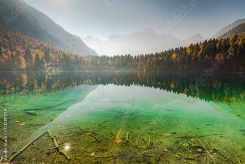 Clear water of Fusine Lake in Italian Alps photo