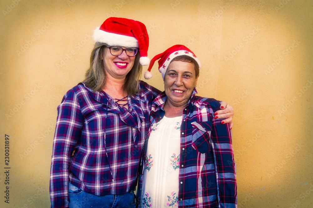 Fototapeta premium portrait of senior women with santa claus hat
