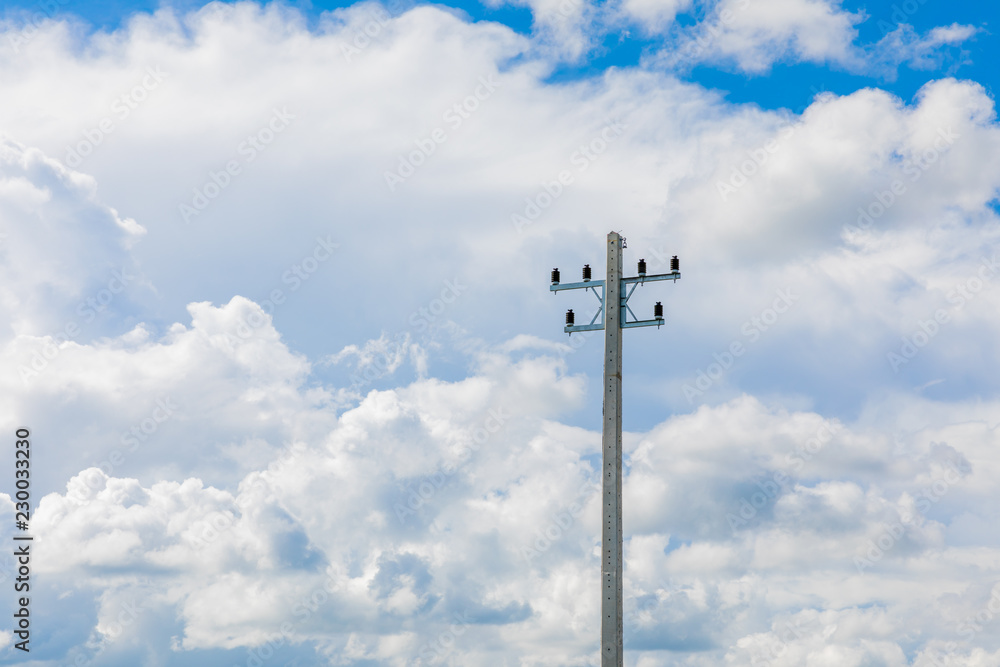 Electrical pole in blue sky background and white cloud.