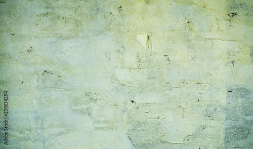 Abstract textured background: mixture of blue and green putty. Uneven strokes, rough texture of a wall pattern