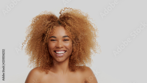 mixed race black blonde model with curly hair