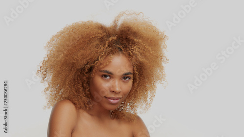 mixed race black blonde model with curly hair