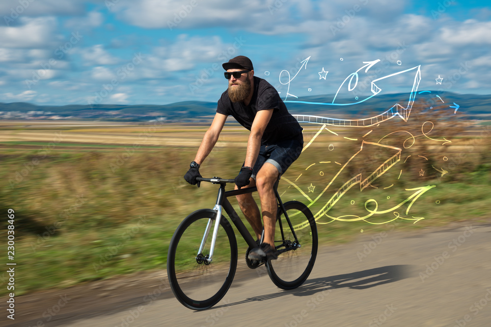 Fototapeta premium Young cyclist in casual clothing with fabulous nature background