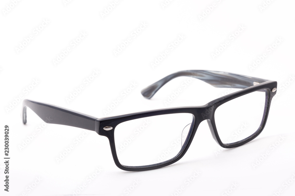 Rectangular black-rimmed glasses are located frontally on a white background. Isolated. Rectangular black-rimmed glasses are located frontally on a white background. Isolated.