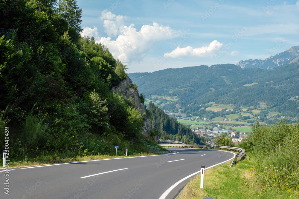 A picturesque asphalted mountain road through the Alps. Austria. A picturesque asphalted mountain road through the Alps. Austria.