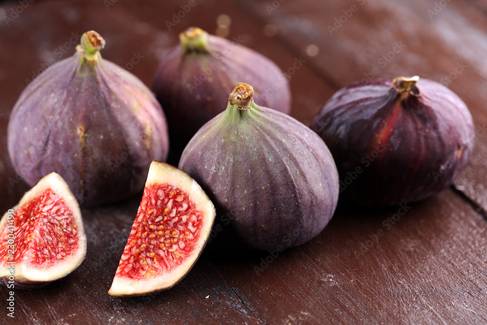 Fresh figs. Food Photo. whole and sliced figs on rustic background. Fresh figs. Food Photo. whole and sliced figs on rustic background.