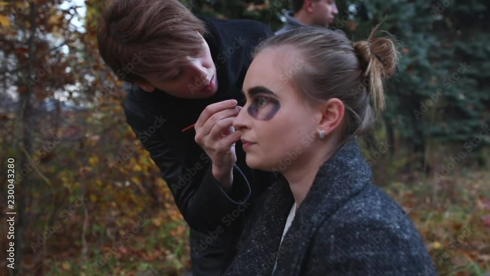 Make-up artist and stylist doing makeup model for Halloween. Make-up artist and stylist doing makeup model for Halloween.