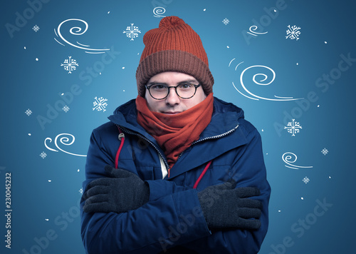 Young hipster frozen boy with doodled snowflakes and windy concept
