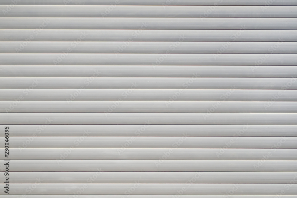 White textured background with horizontal stripes. Garage door. White textured background with horizontal stripes. Garage door.