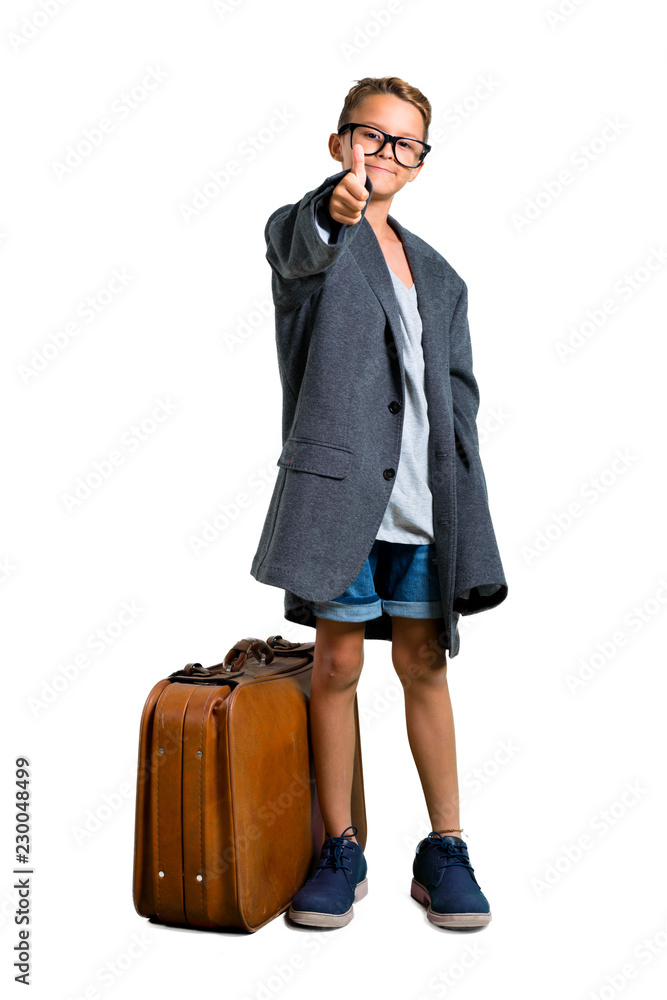 Little boy with his father's clothes playing to be adult with thumb up on isolated white background Little boy with his father's clothes playing to be adult with thumb up on isolated white background