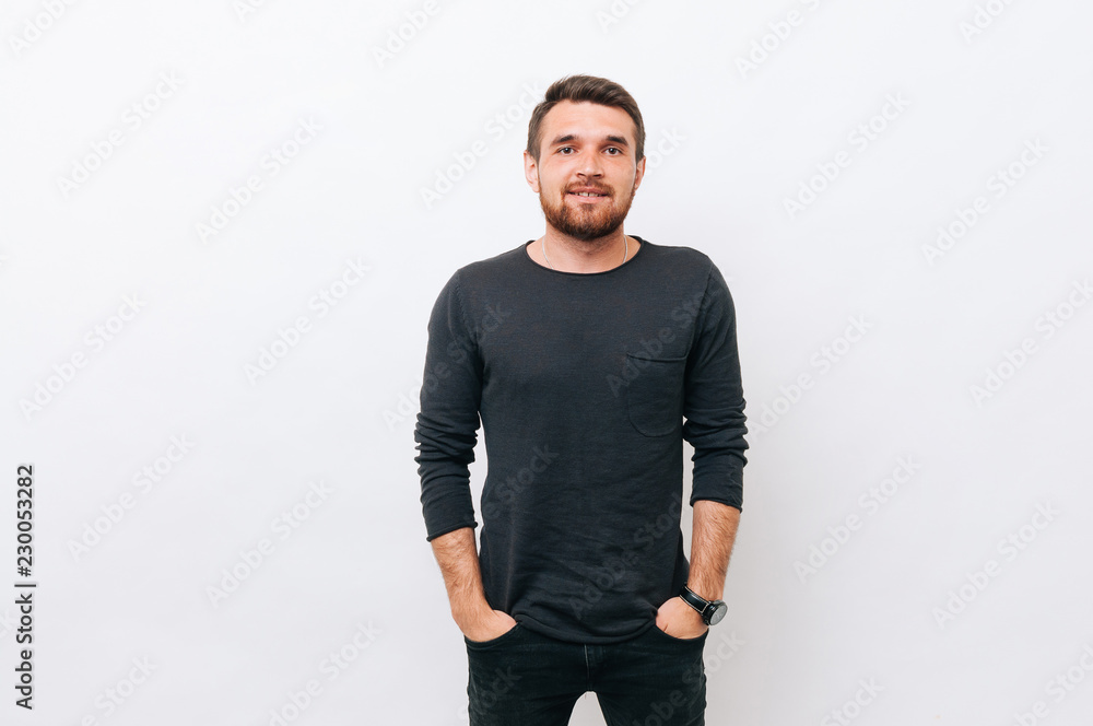 Portrait of handsome cheerful man over white background and looking at the camera Portrait of handsome cheerful man over white background and looking at the camera